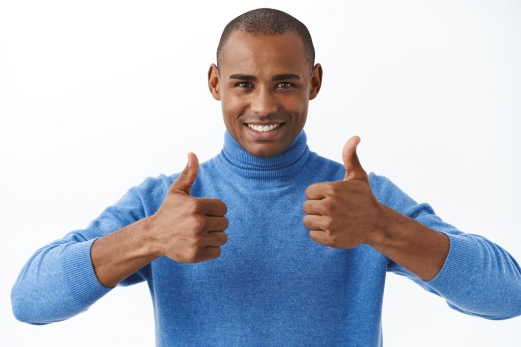 best deal online portrait confident african american man assuring its good show thumbs up as recommend approve like product scaled.jpg